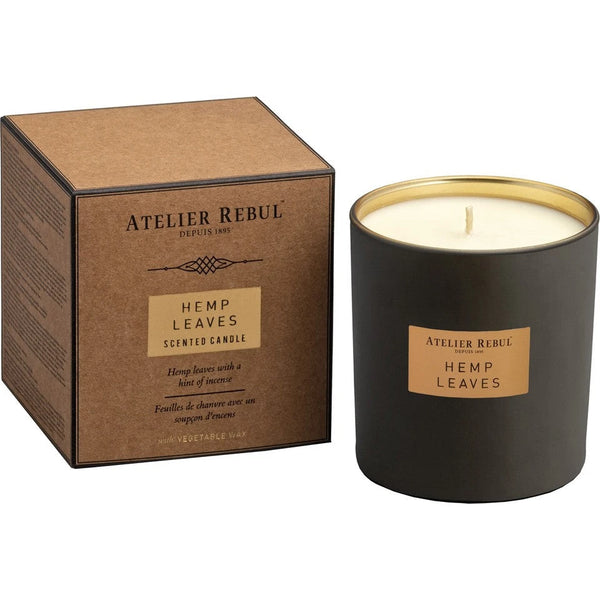 Elegant scented candles in glass jars creating a cozy home atmosphere